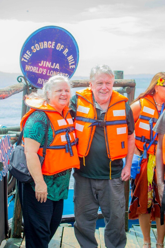 Tourists wearing life vests pose at the Source of the Nile in Jinja, Uganda.